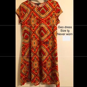 Brand new, flattering, rich geo print dress.